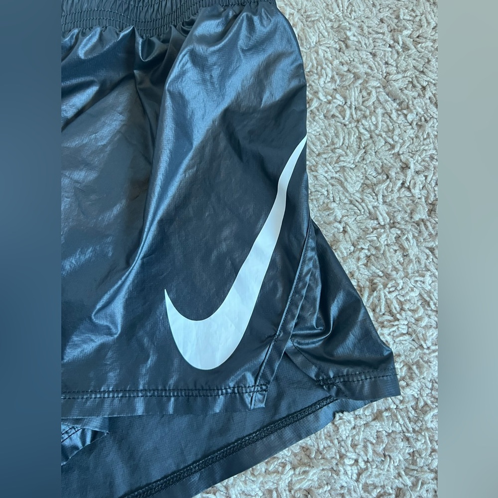 Nike thin pleather shorts. Size medium shiny black